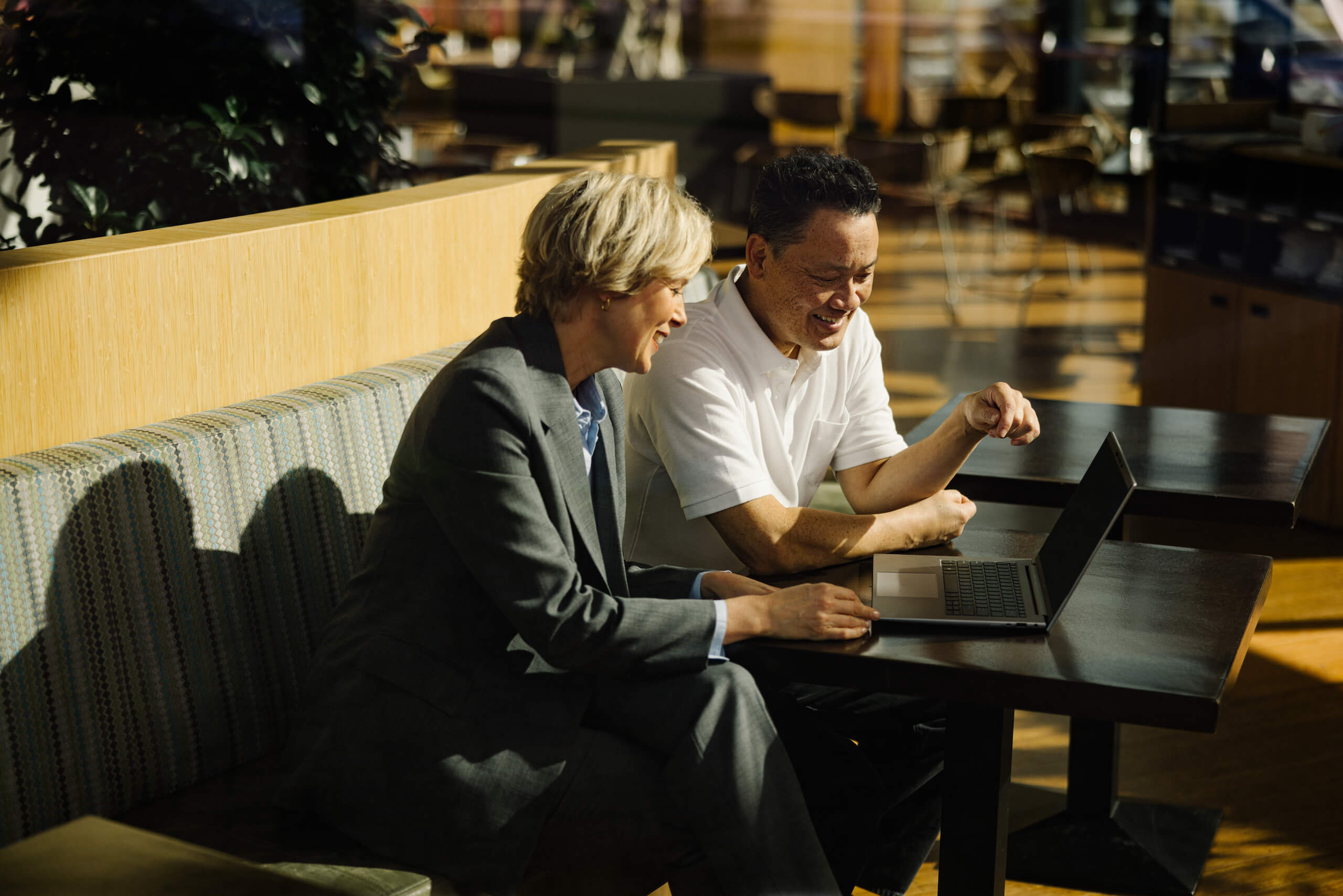 Business Meeting With Laptop In Modern Office Lounge Area